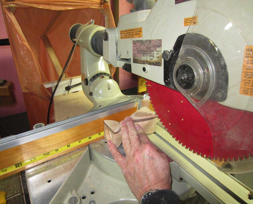 Remove from the lathe and cut bottom to length at the 4¾ mark on the cut