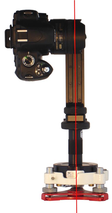 The upper rail is adjusted so that the gold ring is vertically in line with the axis of rotation as shown in the image below. The appropriate adapter for the scanner is used.