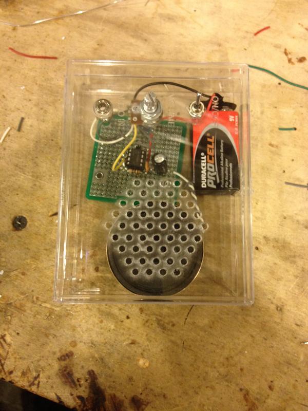 Step 15b - Put circuit into case Using hot glue or tape, attach the speaker to the bottom of the enclosure