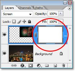 This adds a layer mask thumbnail to Layer 1, and we can see that the layer mask, not the contents of the layer (the fireworks photo), is selected by the white highlight border around the thumbnail: A