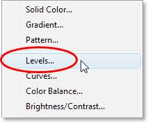 We also want to make sure that our Levels adjustment layer is only affecting the noise layer and has no effect on any other layers, so to do that, hold down your Alt (Win) / Option key and click