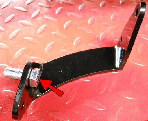 Insert the bolt that will hold your foot peg into the 1/2 hole from the inside as shown. Loosely thread the top bolt in.