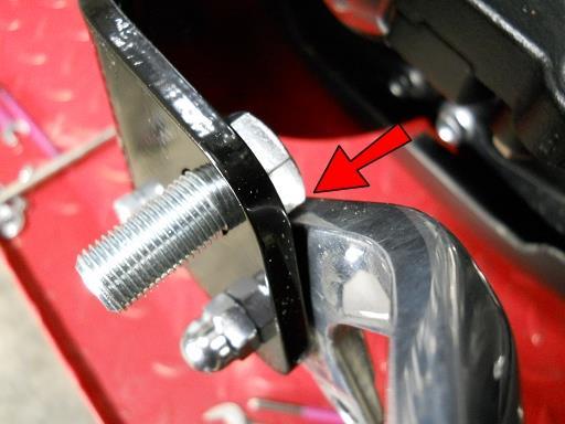 Insert a foot peg bolt so that the flat of the hex head rests against the brake pedal and NOT a point of