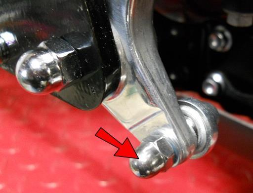 Secure with an M6 Acorn Nut. Secure the rear of the linkage with an M6 Left Hand Nut.