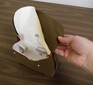 Turn the outer shell right side out. Then, with the inner lining left wrong side out, insert the outer shell inside the inner lining (right sides are together).