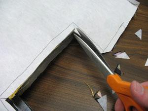 Trim the inner top corners of the seam allowance and cut slits in the inner corners.