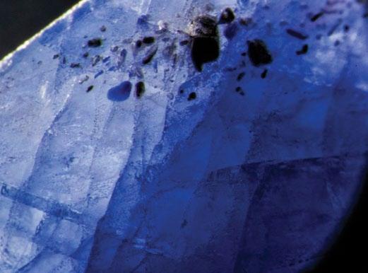 16 Figure 5. Left: Blue pool of cobalt-doped glass fills a surface cavity in this first-generation Tanusorn stone. Dark-field illumination.