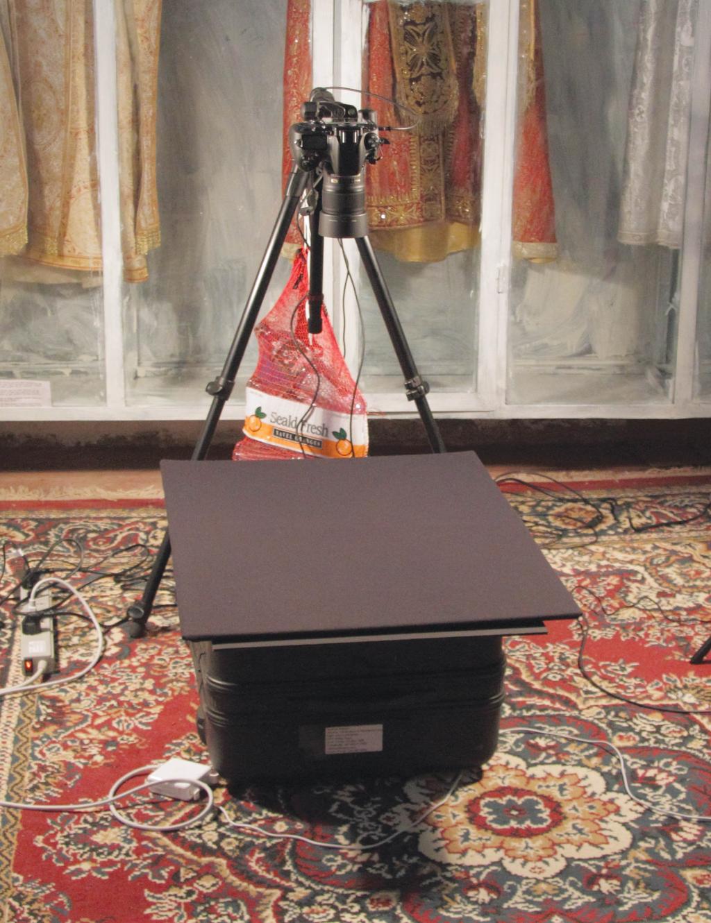 Improvised Manuscript Photography Setup. Tripod with sidearm allows camera to get a straight-down view of the subject matter. Suitcase serves as temporary table.