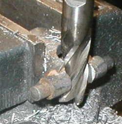 Next, a 1/2" diameter end mill was used to finish the recess in the end of the rod. This shows the finished U joint stub.