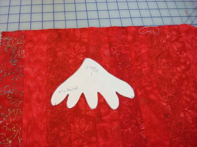 Place top of tree shape on to background fabric 3" down from the top edge and 4" in from
