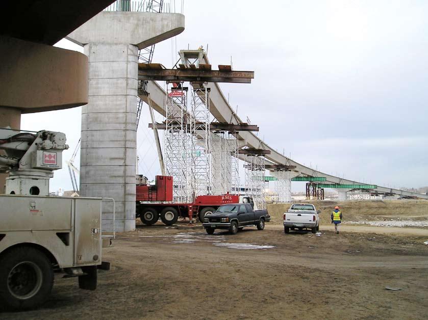 Falsework provides support for beams erected between two cantilevered sections. Once in place, the beams were post-tensioned to provide continuity.