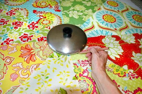 Trim and quilt the sandwich 1. With your fabric pencil, draw a 7" circle in the center of your tree skirt 'sandwich.