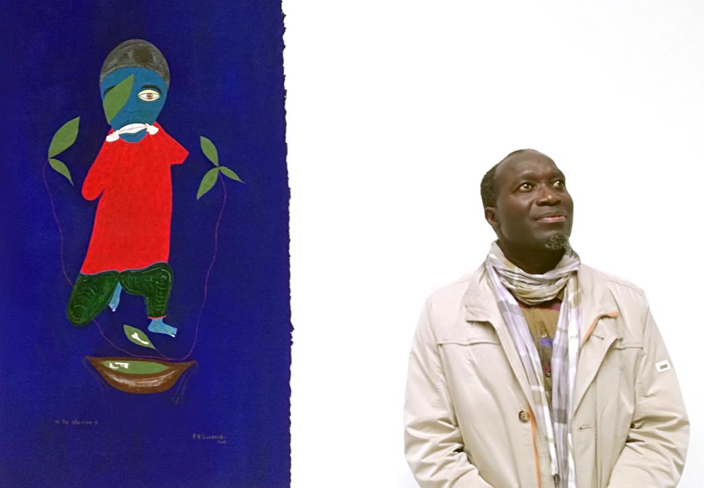 Franck Lundangi, Métamorphose (2016), aquarelle on paper, 82 61 cm Franck Lundangi next to his painting To starve (2008) Franck