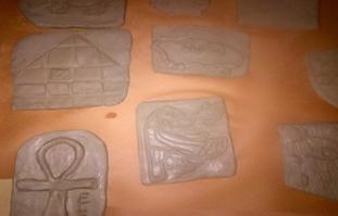 All pieces were carved into and had clay added on to