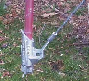 Using a heavy hammer drive the anchor into the soil until 6-8 inches of cable remains above the earth. Remove drive rod.