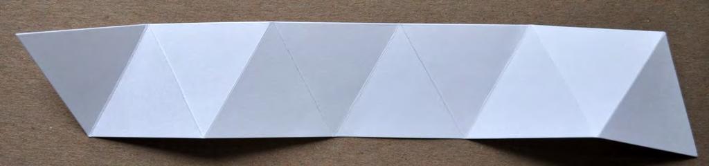 As you fold each side over into the adjacent triangle, keep the triangles centered over each other so they are as