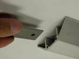 4. Slide aluminum trim connector first into one side,