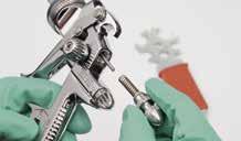 Manual cleaning of spray guns