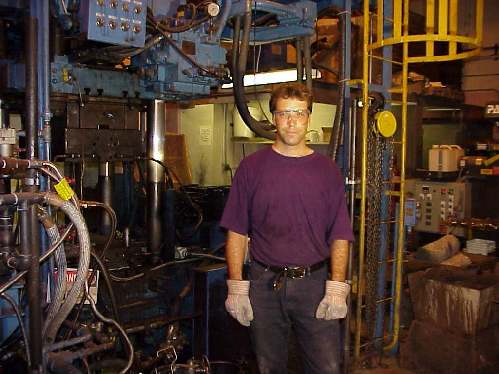 In the foundry Me by a vertical squeeze-caster - an Ube 350T model used to cast Aluminium.