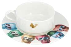 of the rear of all cups Featuring the heads of all of the family on the saucers and two delicate 22kt gold butterflies on each of