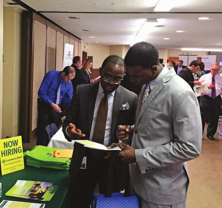 Louis, where Corporate Inclusion and Diversity Manager Walé Soluade, at left, discussed career opportunities with a recently discharged veteran in early 2015.