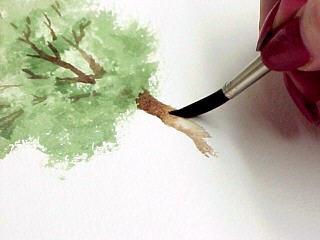 Painting Trees by "Blotting" Highlights with a Paper Towel On 'Rough' or 'Cold Pressed' watercolor paper, paint a patch of color in the shape of a tree.