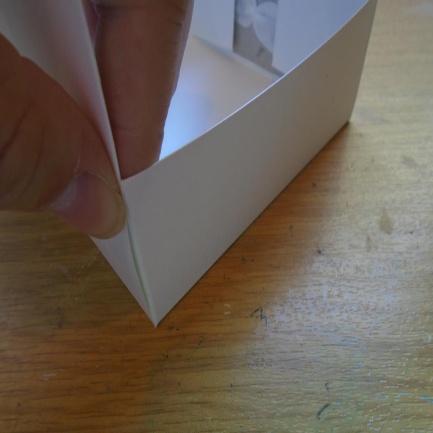 Turn the card over making sure you just watch where the glue touches. If easier add the glue to just 2 of the end tabs first and then repeat after the card is in place.