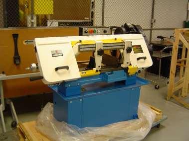 BANDSAW HORIZONTAL: Use a Horizontal Bandsaw to rough cut thick metal stock, using gravity to push the blade through the material. Clamp the work-piece snugly in the vise, but don t over tighten!
