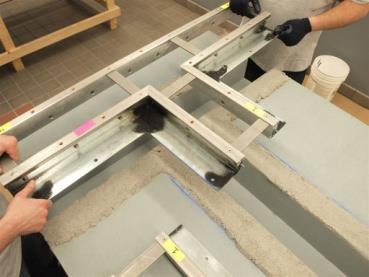 April, 2016, Page 18 of 21 1) FP RAIL TRANSITIONS Place the factory-fabricated transition in the metal FP rails into the wet, epoxy-mortar setting bed.