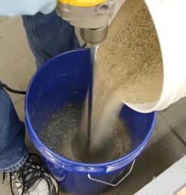 Immediately add the sand from the original EMSEAL pail into the A+B mixture.