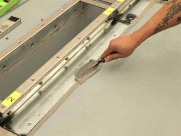 April, 2016, Page 8 of 21 Tool epoxy along the outer edges of the mounting flanges