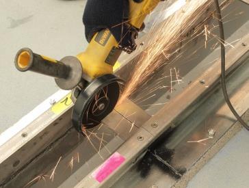 anchors, you must cut through the clamping spacers between the two sides of each rail using a grinder with metal cutting
