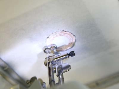 Attach the hoop back onto the machine and continue embroidering the design.