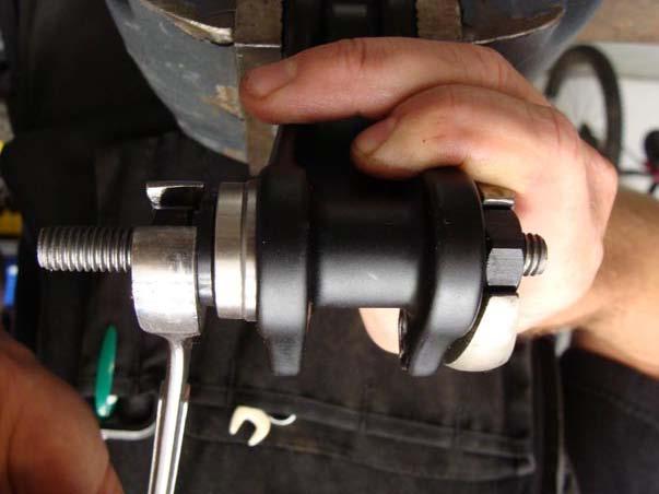 4. d) Tighten the tool with your 11/16" or adjustable wrenches until the bearing bottoms out. 5.