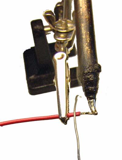 0mm crimp pins below 24 AWG generally require the casing to terminate outside the clasp in the crimp pin.