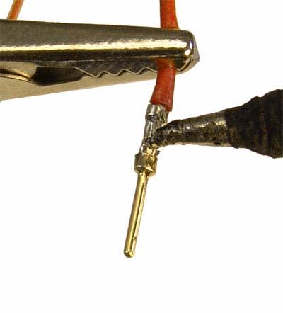 Pictured in Figure #9 is a 22 AWG wire on a MaxBit 11000 crimp pin. Please note that the wire casing ends just before the outside clasp tabs.