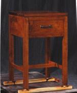 Features one drawer containing a velvet drawer bottom liner. Maple solids.