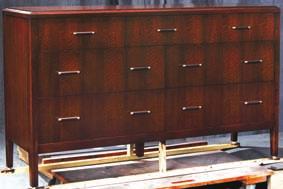 Top drawer contains a velvet drawer bottom liner. Reverse tapered posts. Leather look bar pulls with satin nickel trim.