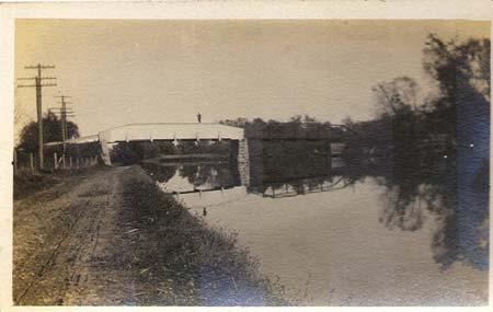 Shown below are the front and back sides of a Kodak postcard showing a bridge in Seneca Falls, NY.