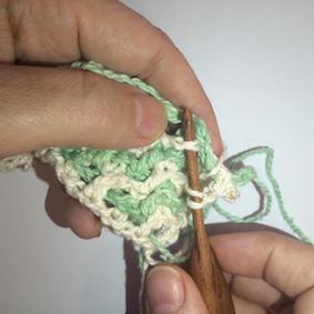 Double Crochet in Front Remember you want to work INTO the double crochet, not into the ch-space of that colour.