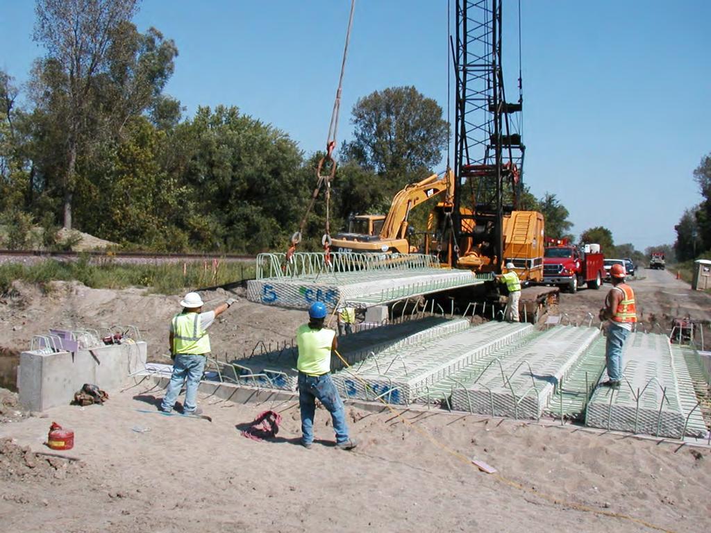 Precast Inverted Tee Slab Spans MnDOT developed system in 2005 based on similar section used in France First bridges built in 2005, and 11 have been built as of 2011