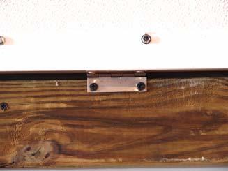 If Angle the Wood screws down as you put them in to pull the Door down tight to the Black P-Seal.