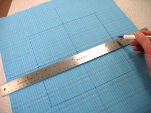 Draw a square in the center of the fabric.