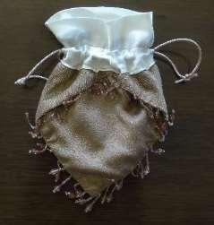 For a flat or four-sided reticule: Cut two 18-24 lengths of cording, sturdy ribbon, or similar for the drawstrings.