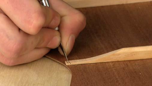 Cover the stick with 80-grit sandpaper, taping the sandpaper in place. Lay this stick across the sides and sand evenly over every point, in all directions.