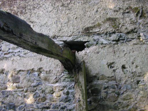 refuge Plate 8: The hole in a wall behind a rotted timber beam