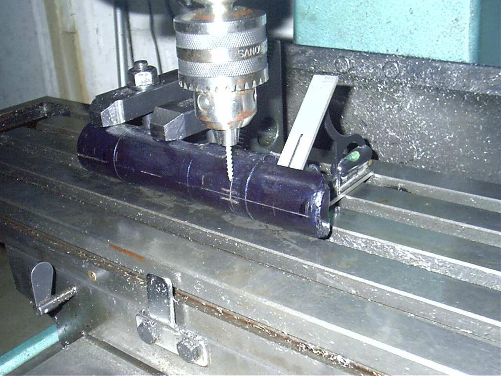 I now install a new 3/8 inch carbide center cutting end mill in the mill and make the first of two side milling cuts into the receiver.