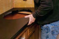 of silicone adhesive to the underside edge of the sink cutout Place sink back on the countertop and match up the two center marks Lightly insert screws into each pre-drilled mounting hole Turn
