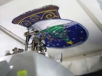 After removing the tape, embroider the "globe tack
