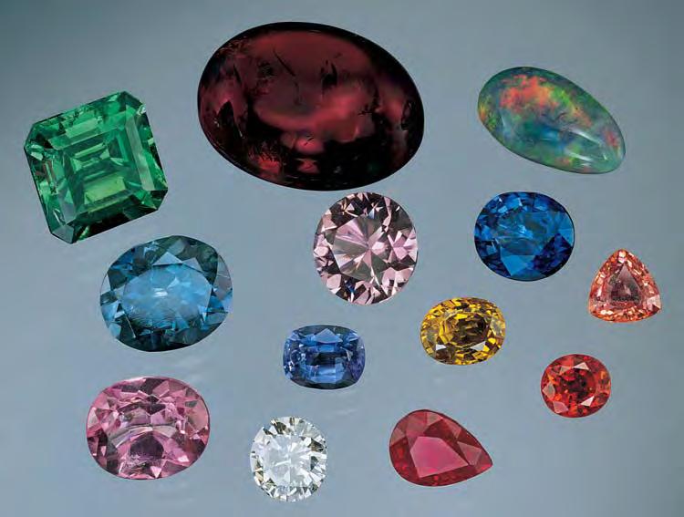 Figure 1. Many methods are now used to enhance gems. Illustrated here are, from left to right, starting at the top: (row 1) 5.66 ct clarityenhanced emerald, 10.60 ct heated amber, 3.